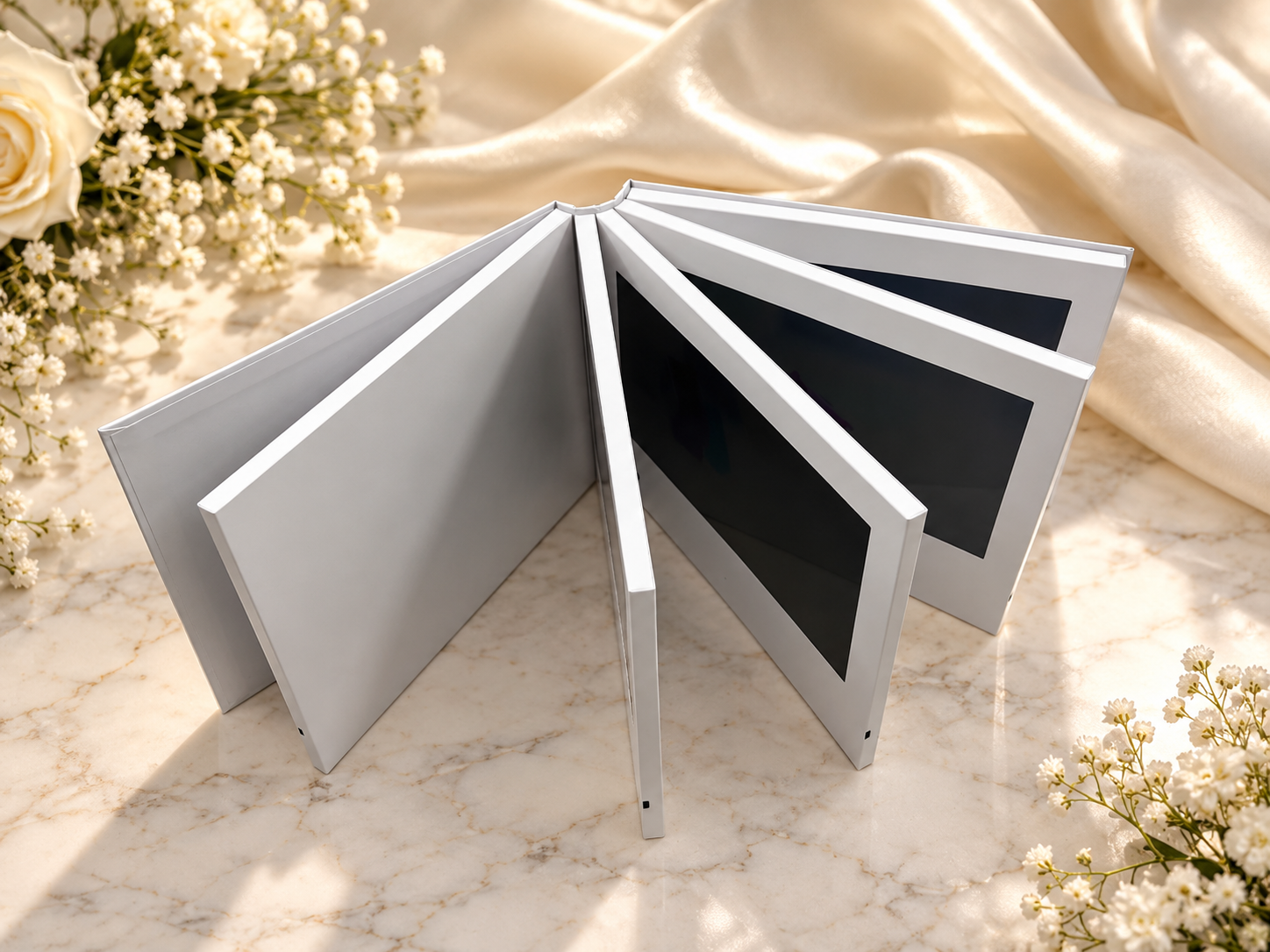 Ivory video book with its screen pages fanned open